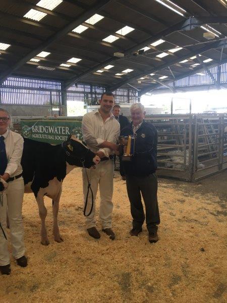 Holstein-South-West-Calf-Show-2017-MattHouse-being-presented-with-his-prize-by-Lionel-Bagg.jpg